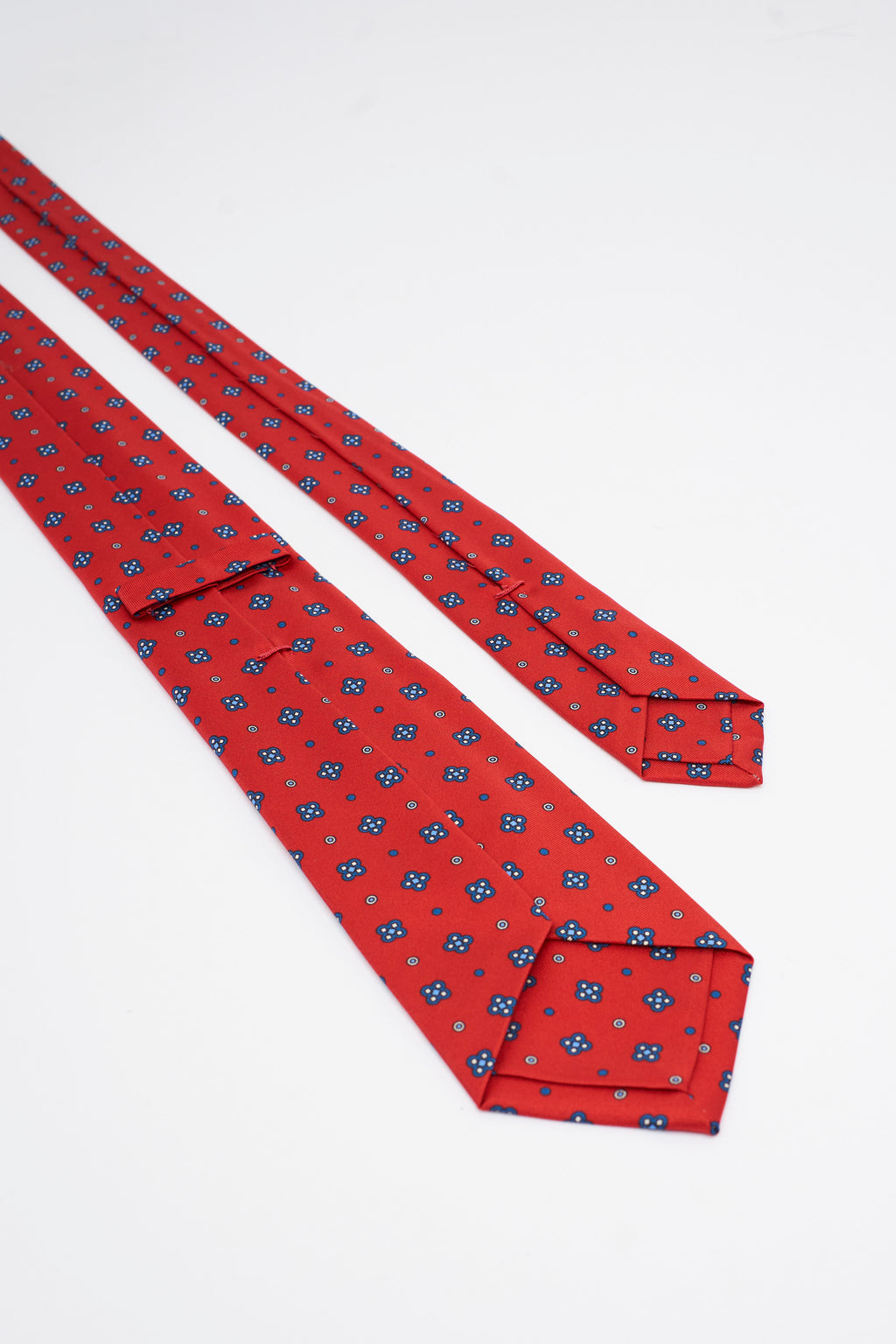 Cravatta in Seta Rossa con Motivo a Fiori Geometrici
